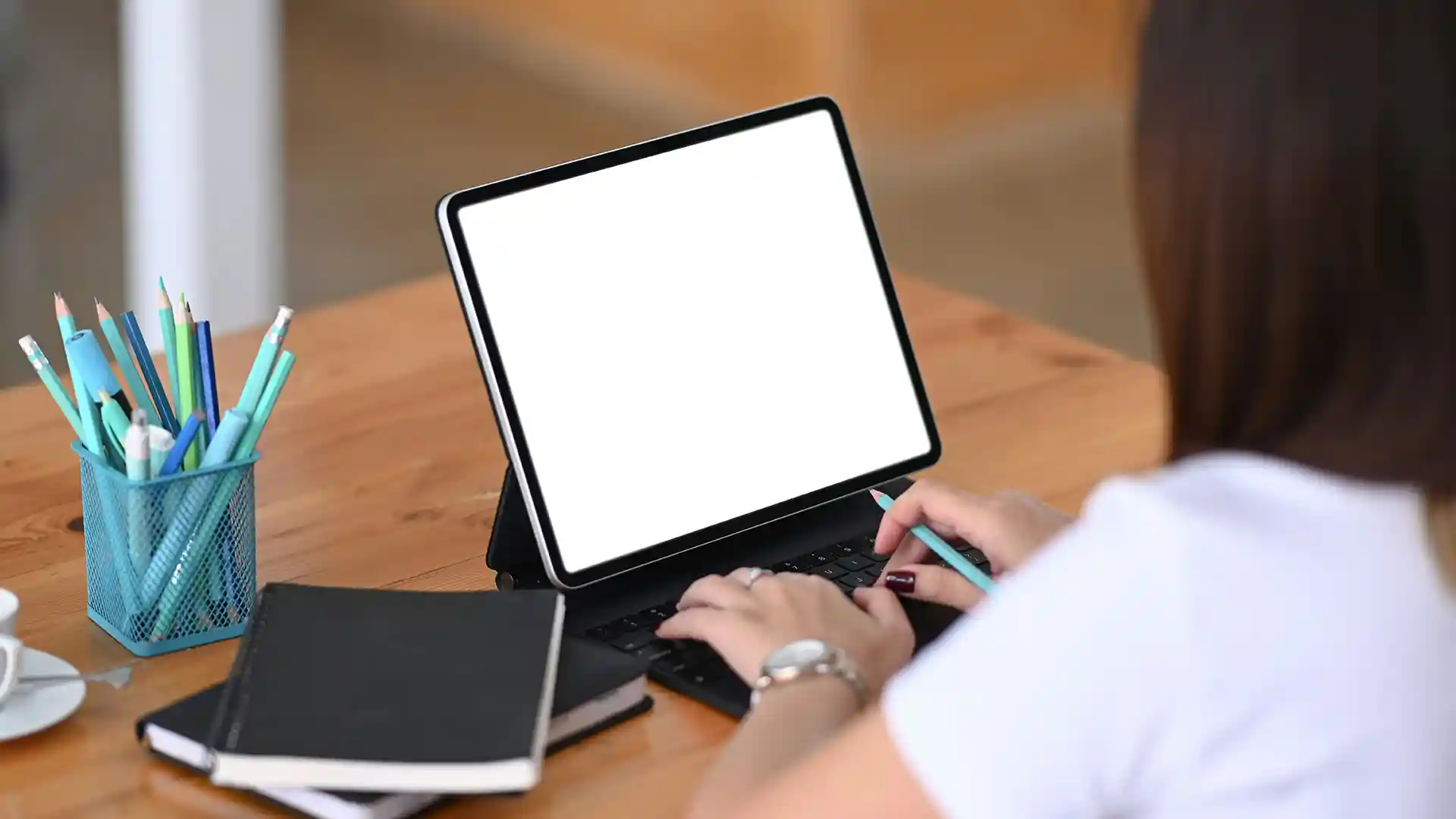 Woman working at a desk.