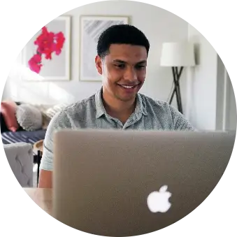 Young man working on a Macbook.