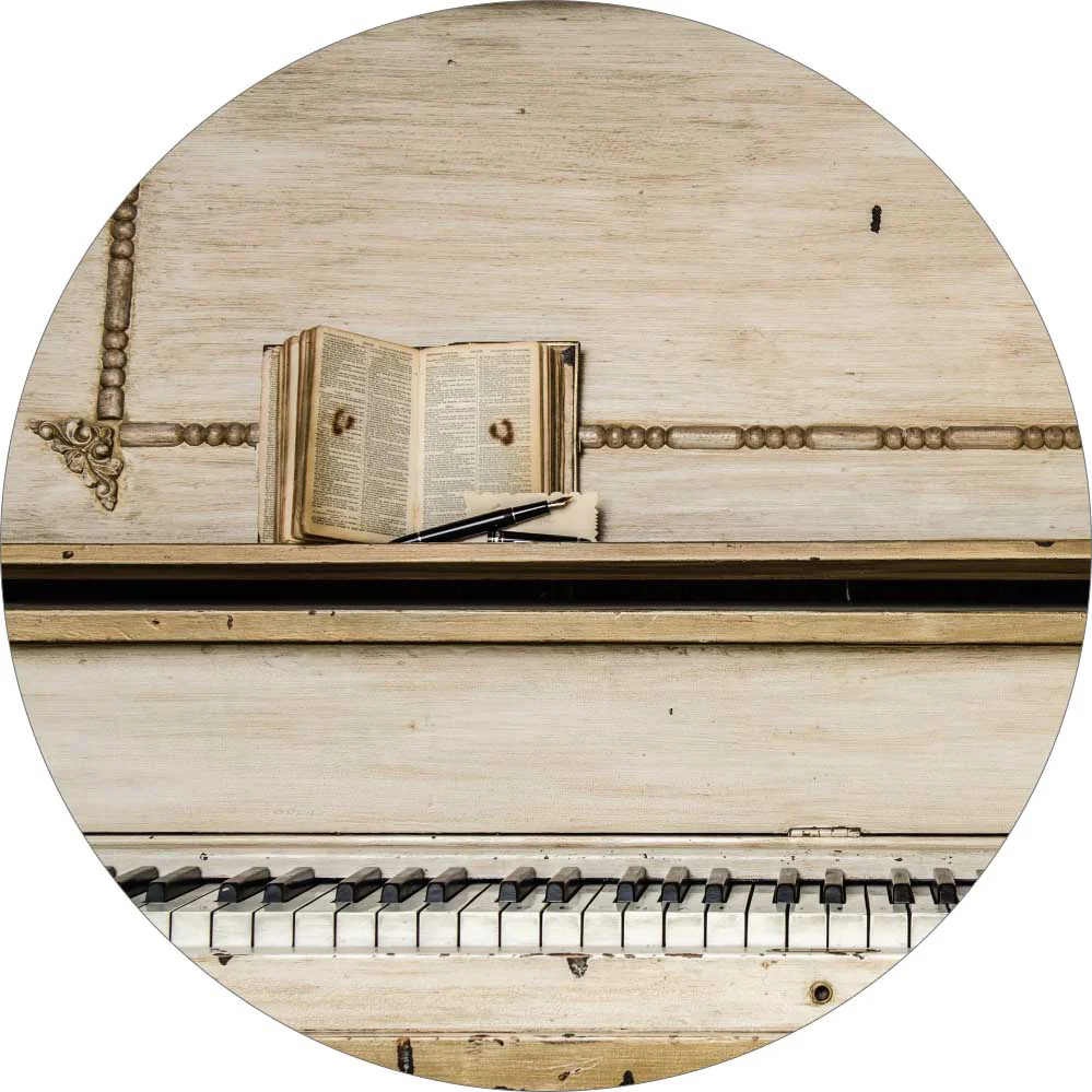 A keyboard of antique white piano and a music book